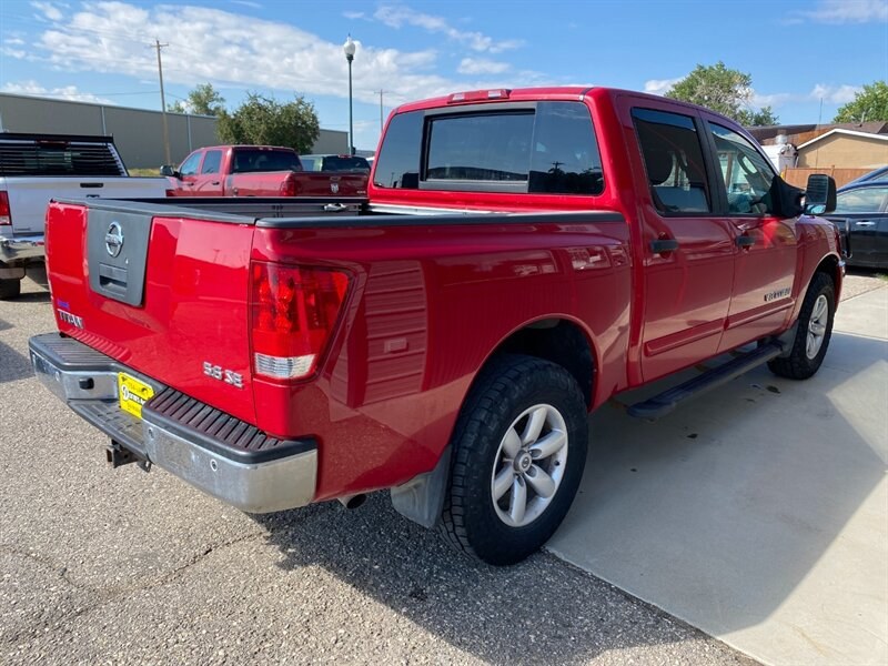2010 Red Alert Nissan Titan SE (1N6AA0EC2AN) with an 5.6L V8 317hp 385ft. lbs. engine, Automatic transmission, located at 842 E South Street, Powell, WY, 82435, (307) 754-7289, 44.752300, -108.746933- Photo#2