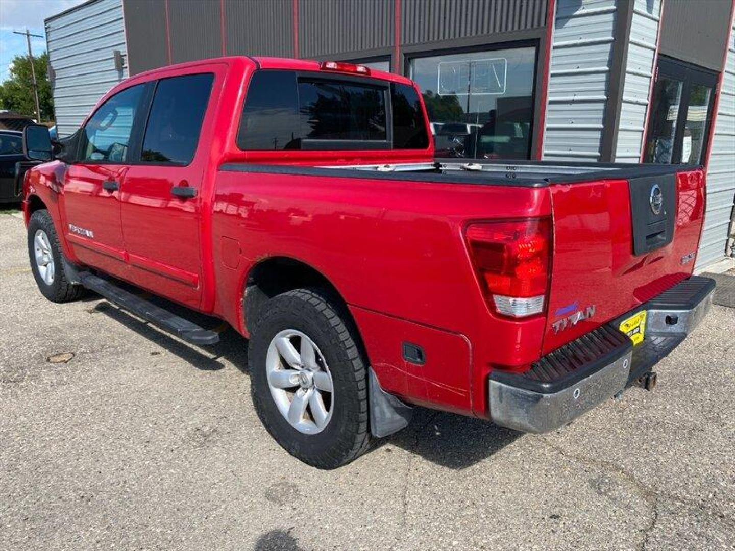 2010 Red Nissan Titan SE (1N6AA0EC2AN) with an 5.6L V8 317hp 385ft. lbs. engine, Automatic transmission, located at 842 E South Street, Powell, WY, 82435, (307) 754-7289, 44.752300, -108.746933 - Photo#3