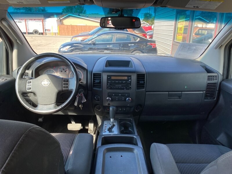 2010 Red Alert Nissan Titan SE (1N6AA0EC2AN) with an 5.6L V8 317hp 385ft. lbs. engine, Automatic transmission, located at 842 E South Street, Powell, WY, 82435, (307) 754-7289, 44.752300, -108.746933- Photo#7