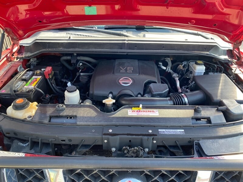 2010 Red Alert Nissan Titan SE (1N6AA0EC2AN) with an 5.6L V8 317hp 385ft. lbs. engine, Automatic transmission, located at 842 E South Street, Powell, WY, 82435, (307) 754-7289, 44.752300, -108.746933- Photo#15
