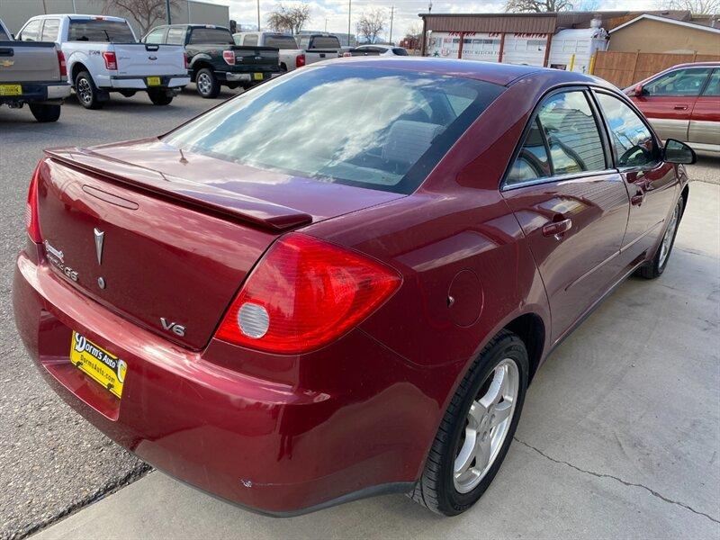 2009 Performance Red Metallic Pontiac G6 (1G2ZG57N594) with an 3.5L V6 219hp 219ft. lbs. engine, Automatic transmission, located at 842 E South Street, Powell, WY, 82435, (307) 754-7289, 44.752300, -108.746933- Photo#2