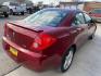 2009 Performance Red Metallic Pontiac G6 (1G2ZG57N594) with an 3.5L V6 219hp 219ft. lbs. engine, Automatic transmission, located at 842 E South Street, Powell, WY, 82435, (307) 754-7289, 44.752300, -108.746933 - Photo#2