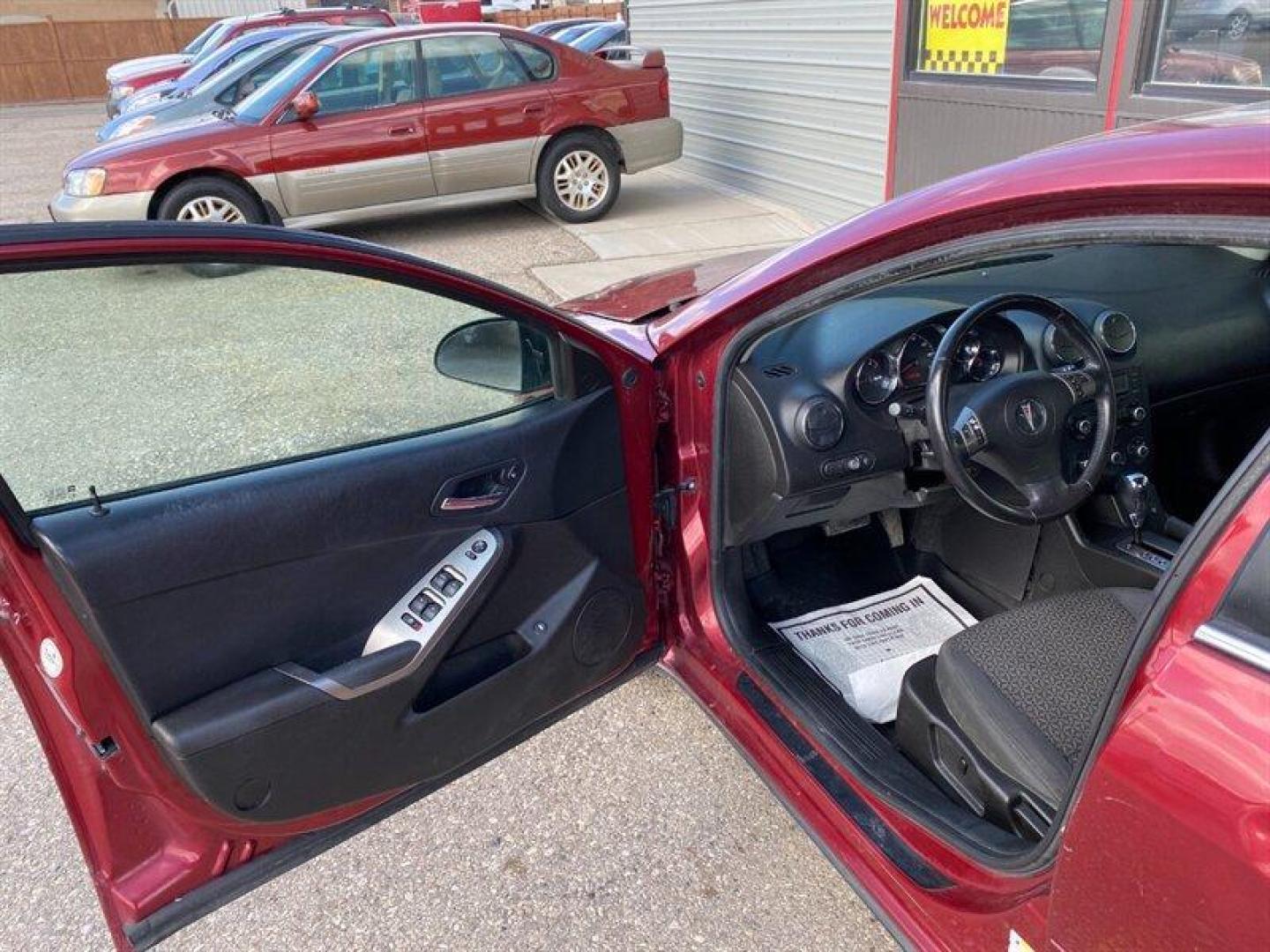 2009 Performance Red Metallic Pontiac G6 (1G2ZG57N594) with an 3.5L V6 219hp 219ft. lbs. engine, Automatic transmission, located at 842 E South Street, Powell, WY, 82435, (307) 754-7289, 44.752300, -108.746933 - Photo#4