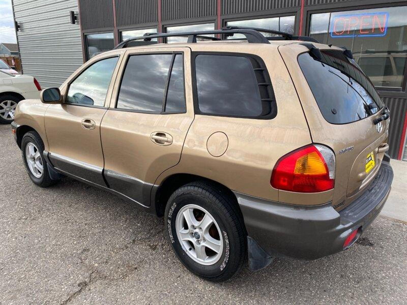 2003 Gold Hyundai SANTA FE (KM8SB12BX3U) with an 2.4L I4 138hp 147ft. lbs. engine, 5 Speed Manual transmission, located at 842 E South Street, Powell, WY, 82435, (307) 754-7289, 44.752300, -108.746933 - Photo #3