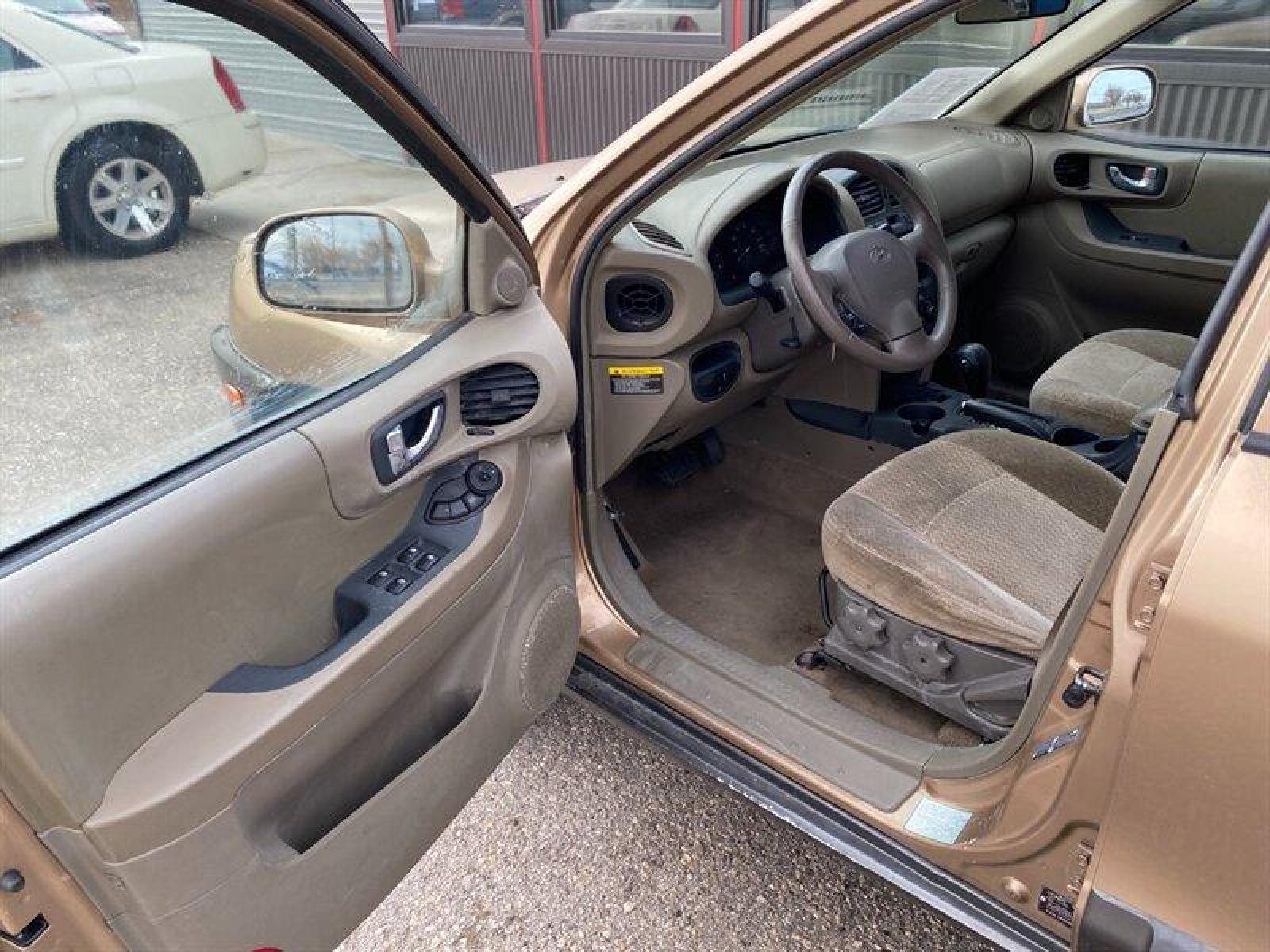 2003 Gold Hyundai SANTA FE (KM8SB12BX3U) with an 2.4L I4 138hp 147ft. lbs. engine, 5 Speed Manual transmission, located at 842 E South Street, Powell, WY, 82435, (307) 754-7289, 44.752300, -108.746933 - Photo #4
