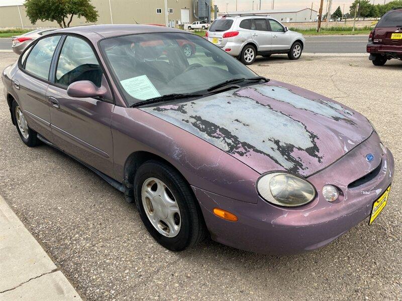 1996 Midnight Red Clearcoat Metallic Ford Taurus GL (1FALP52U2TA) with an 3.0L V6 145hp 170ft. lbs. engine, Automatic transmission, located at 842 E South Street, Powell, WY, 82435, (307) 754-7289, 44.752300, -108.746933- Photo#1