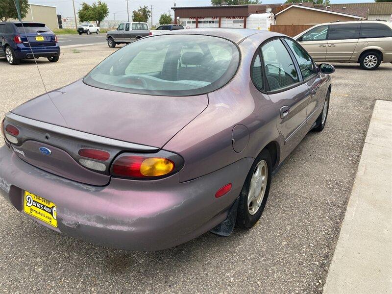 1996 Midnight Red Clearcoat Metallic Ford Taurus GL (1FALP52U2TA) with an 3.0L V6 145hp 170ft. lbs. engine, Automatic transmission, located at 842 E South Street, Powell, WY, 82435, (307) 754-7289, 44.752300, -108.746933- Photo#2