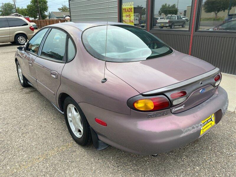 1996 Midnight Red Clearcoat Metallic Ford Taurus GL (1FALP52U2TA) with an 3.0L V6 145hp 170ft. lbs. engine, Automatic transmission, located at 842 E South Street, Powell, WY, 82435, (307) 754-7289, 44.752300, -108.746933- Photo#3