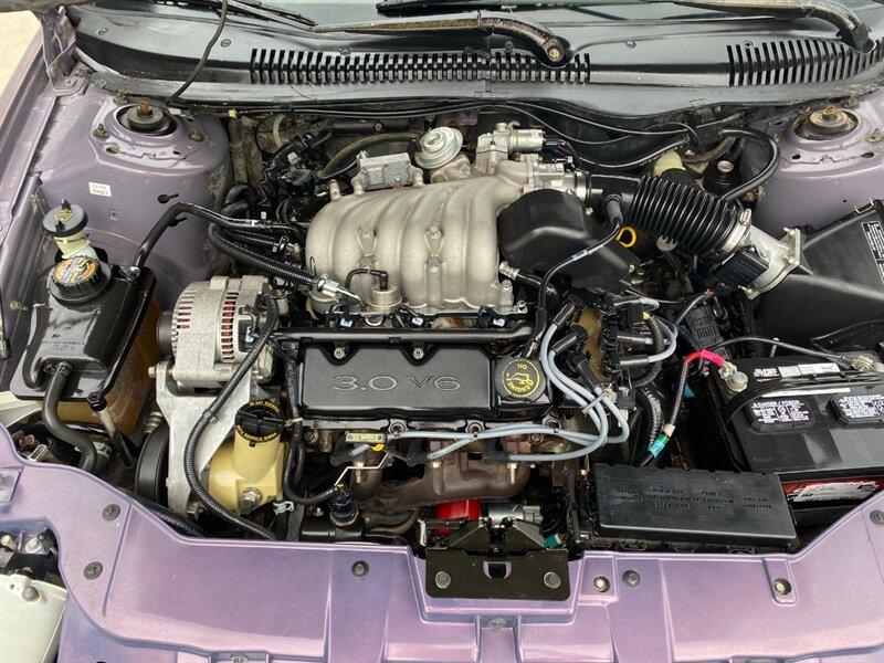 1996 Midnight Red Clearcoat Metallic Ford Taurus GL (1FALP52U2TA) with an 3.0L V6 145hp 170ft. lbs. engine, Automatic transmission, located at 842 E South Street, Powell, WY, 82435, (307) 754-7289, 44.752300, -108.746933- Photo#20
