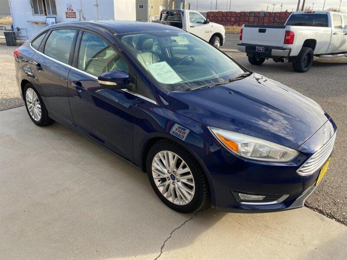 2017 Blue Ford Focus Titanium (1FADP3J25HL) with an 2.0L Flex Fuel I4 160hp 146ft. lbs. engine, 6-Speed Double Clutc transmission, located at 842 E South Street, Powell, WY, 82435, (307) 754-7289, 44.752300, -108.746933 - Photo#1